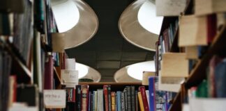 books on brown wooden shelf