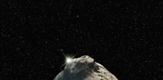 a large rock in the middle of a space filled with stars