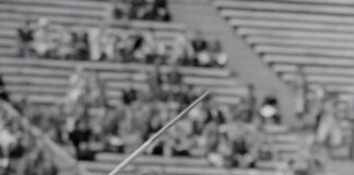 woman doing javelin throw photograph