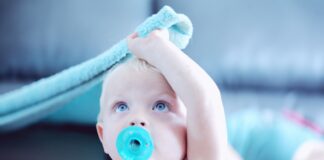 baby with pacifier in mouth