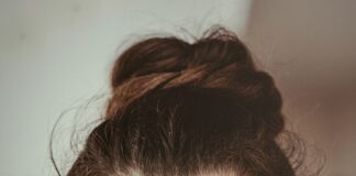 smiling woman holding cheek