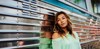woman leaning on bus