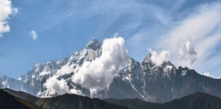 snow covered mountain under blue sky during daytime
