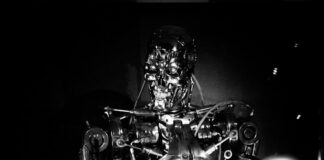 a black and white photo of a robot