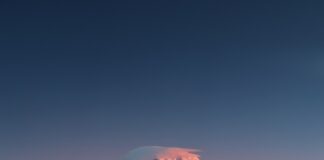 icy mountain covered white clouds