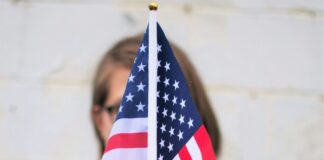 person holding USA Flag