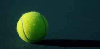 green tennis ball on ground