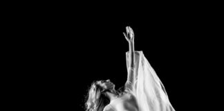 grayscale photography of woman doing ballet