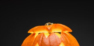 jack o lantern on brown wooden table