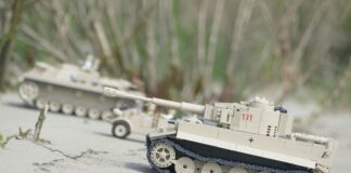 brown battle tank on snow covered ground