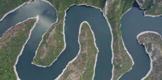 an aerial view of a body of water surrounded by land