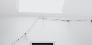 brown wooden rectangular frame on white wall