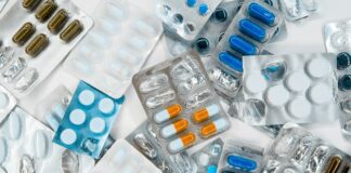 a pile of pills sitting next to each other on top of a table