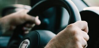 man driving Fiat car