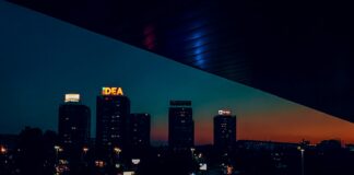 a view of a city at night from a balcony