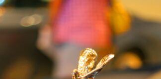 gold and black car hood ornament