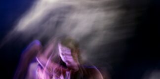 a blurry photo of a man and a woman dancing