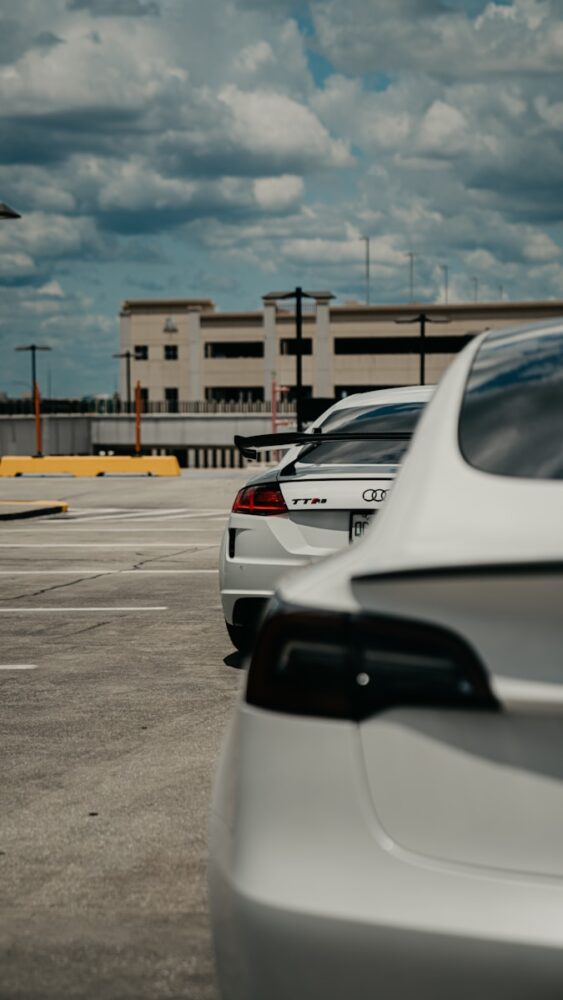 a row of parked cars in a parking lot