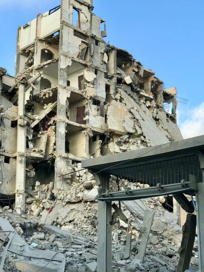 A very large building that has a bunch of rubble on it
