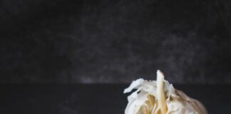 white garlic on black table