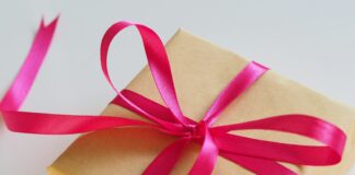 brown gift box with pink ribbon