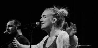 woman standing front of microphone
