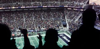 a crowd of people watching a football game
