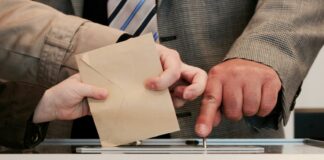 person standing near table