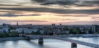 bridge over river during sunset