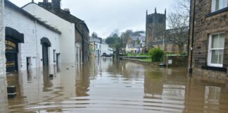 flooded town under blue sky and white clouds