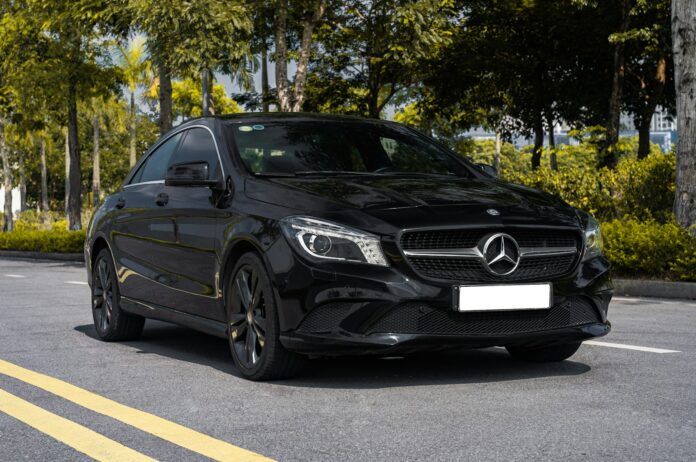a black car parked in a parking lot
