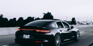 running black Porsche sedan
