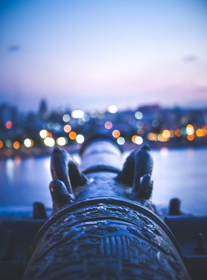 a view of a body of water with a city in the background