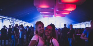 two women wearing white shirts