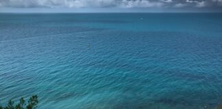 a body of water with a boat in the distance
