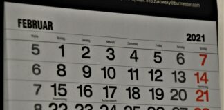 black and white calendar on white wall