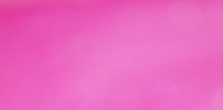 a pink and gold background with lots of gold glitter