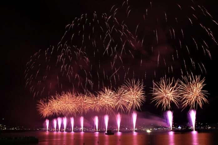a bunch of fireworks are lit up in the night sky