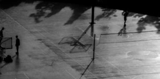 person walking on basketball court