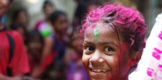 selective focus photo of girl in shirt smiling