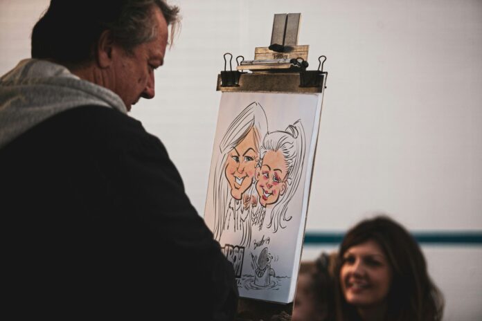 man painting two women