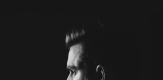grayscale photo of man wearing blazer
