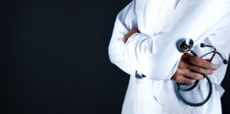 man in white thobe standing