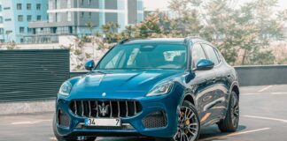 a blue masera parked in a parking lot