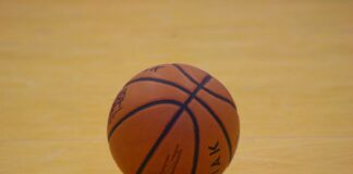 a close up of a basketball on a court