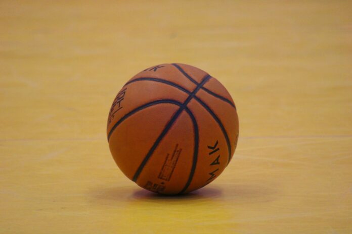 a close up of a basketball on a court