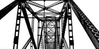 a black and white photo of a bridge