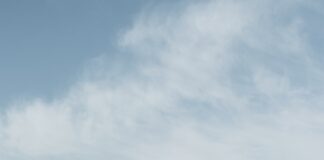 a view of a city with mountains in the background