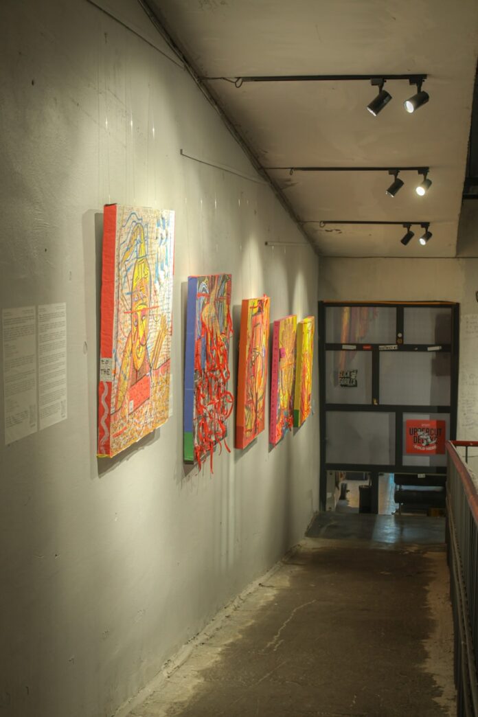 A long hallway with paintings on the wall