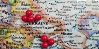 a map with a bunch of red balls on it